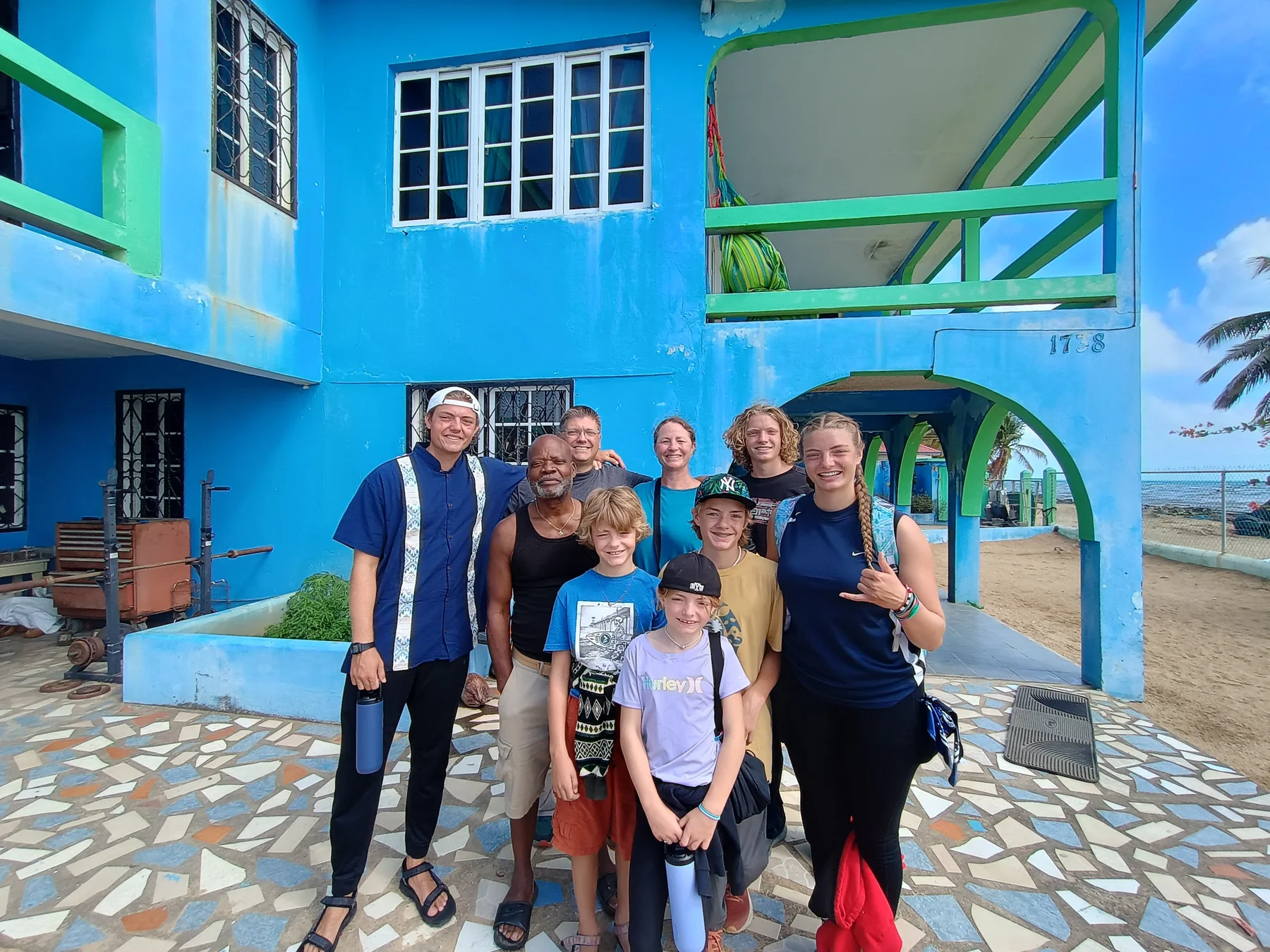 Family and community members together during service work in Belize